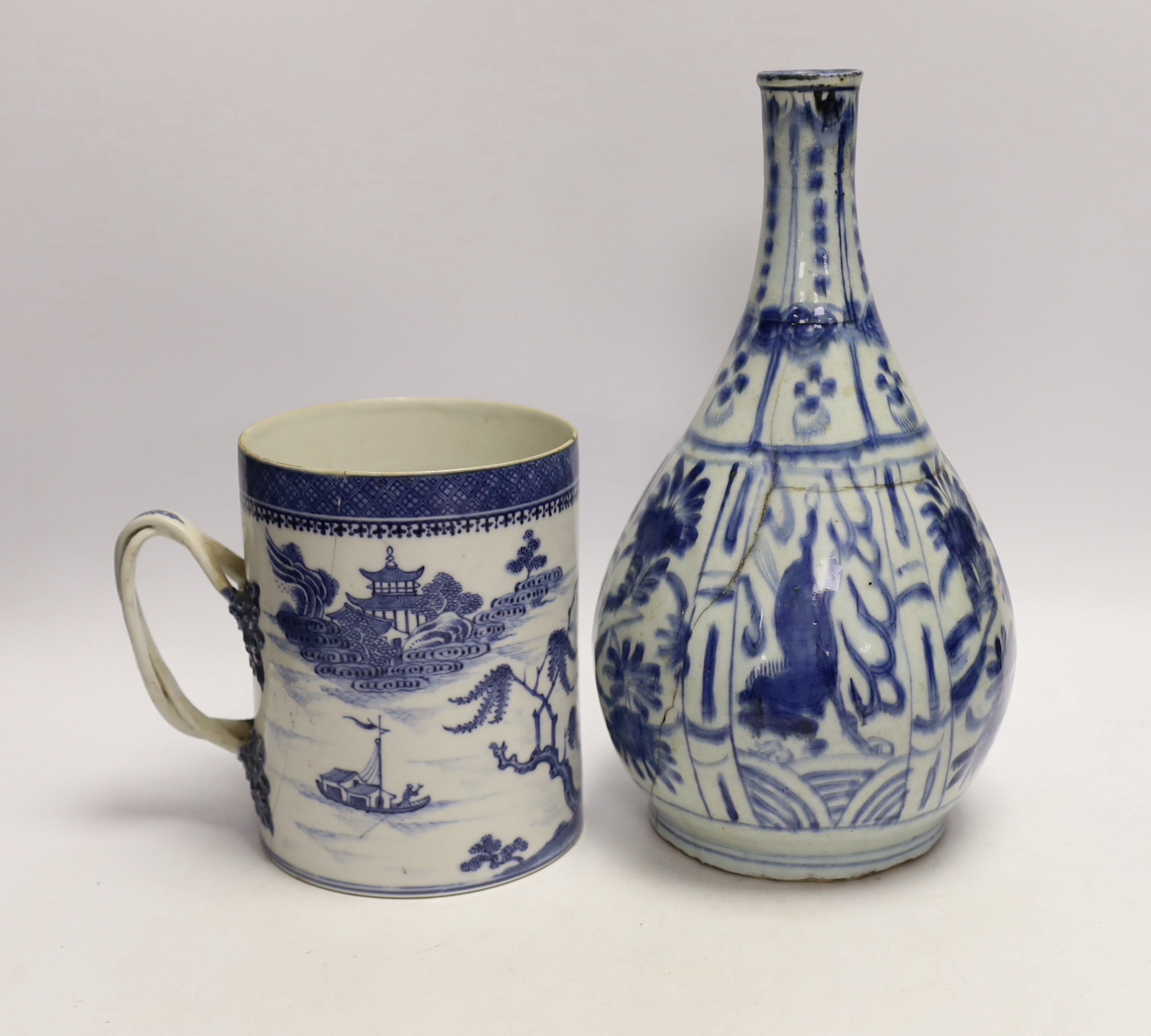 An 18th century Chinese export mug and a Chinese late Ming blue and white bottle vase, vase 29cm